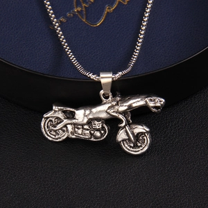 Vintage silver leopard motorcycle pendant necklace with a punk rock and biker aesthetic