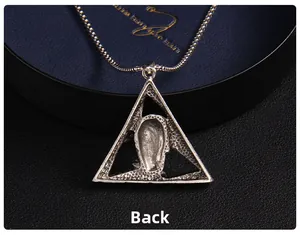 Back view detail of punk skull triangle pendant featuring a rugged matte metal texture