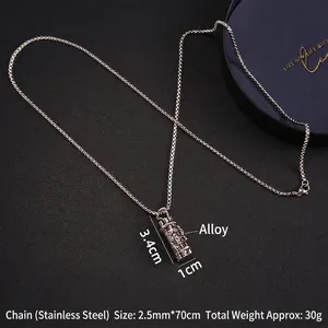 Men's punk Gatling cylinder pendant necklace in stainless steel on black texture