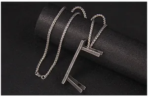 Detailed view of the vintage silver keel chain and unique wooden textured bench pendant