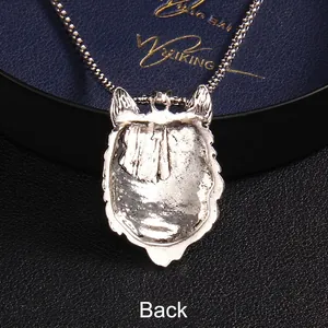 Reverse side of wolf head pendant in silver stainless steel with textured metal finish