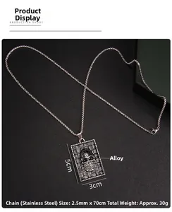 Detailed view of dark punk skull pendant on stainless steel box chain necklace