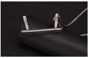 Detailed view of stool pendant with realistic wood grain texture and vintage silver finish