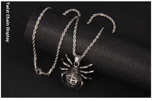 Detail view of gothic spider pendant with textured shield design on a steel rope chain