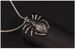 Macro view of a punk spider pendant necklace in vintage silver steel with rope chain