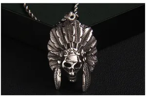 Detailed close-up of a silver stainless steel Indian feather skull pendant and rope chain