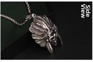 Side view detail of vintage stainless steel Indian chief skull pendant with feather headdress