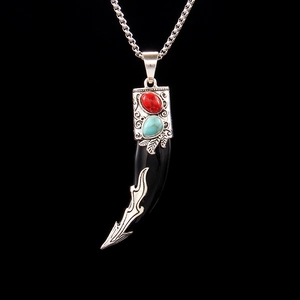Vintage tribal wolf tooth pendant necklace with red stone and turquoise details