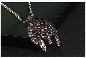 Macro shot of punk style stainless steel Indian feather headdress skull necklace pendant