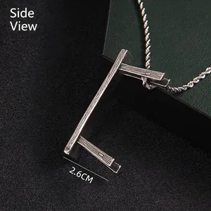 Side view of stainless steel wood grain chair pendant necklace with twist chain 2.6CM