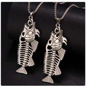 Close-up of vintage punk fishbone pendant with detailed retro silver hollow design