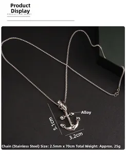 Detailed view of punk anchor pendant with four skulls on black leather background