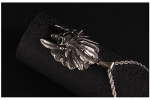 Detailed close-up of a punk style stainless steel Indian chief skull necklace pendant