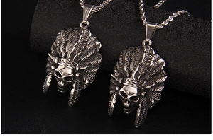 Detail of vintage punk Indian chief skull necklace with ball and twisted chains