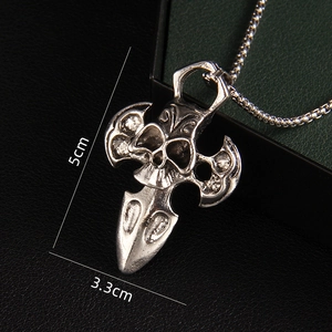 Gothic skull and axe pendant necklace in vintage silver with dimensions 5cm by 3.3cm