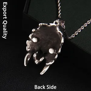 Back view of silver punk style claw pendant in stainless steel on black leather background