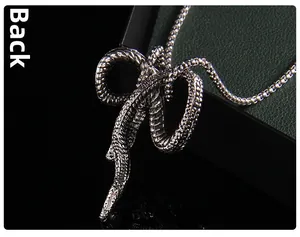 Macro detail of the back structure and scale texture on the vintage snake pendant