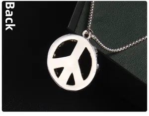 Detailed back view of the silver peace sign pendant with bead chain on black leather