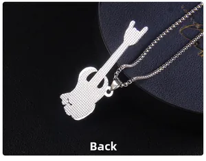 Macro detail of the silver rock hand guitar pendant back with textured finish