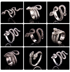 Detailed view of nine vintage silver snake rings with textured scales and punk metal finish