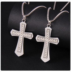 Macro shot of silver stainless steel cross pendants with inlaid crystal rhinestones