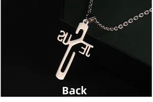 Macro shot of the polished silver stainless steel Jesus cross pendant back view