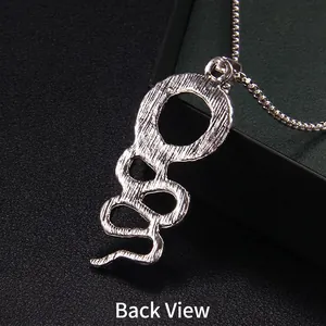 Gothic silver snake pendant necklace featuring detailed scale texture and back view detail