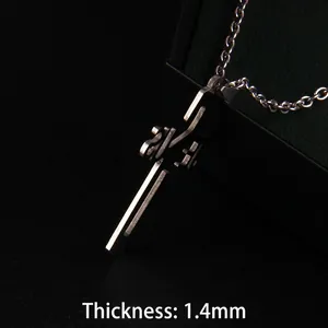 Polished stainless steel JESUS cross necklace with 1.4mm thickness on black background
