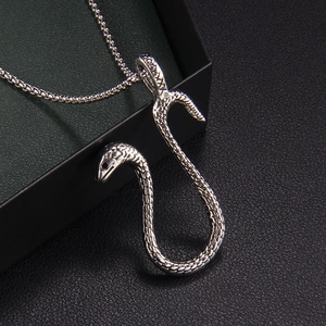Gothic silver snake pendant necklace featuring detailed scales and vintage finish