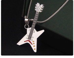 Macro shot of stainless steel electric guitar pendant with colorful enamel details