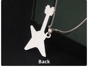Detailed macro view of silver guitar pendant with unique honeycomb textured back design