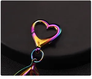 Macro shot of a rainbow gradient heart-shaped lobster clasp for keychains and bag charms