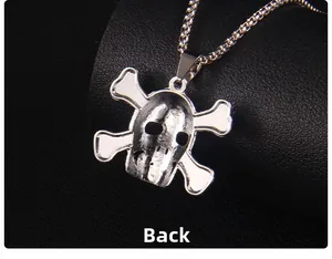 Macro view of the detailed metal casting on the back of the skeleton guitar pendant