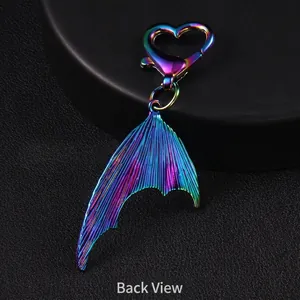 Gradient metal fishtail keychain with heart-shaped clip showing the polished back view