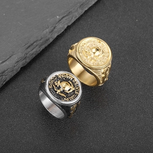 Gold and silver USMC eagle rings with United States Marine Corps engraving on stone base
