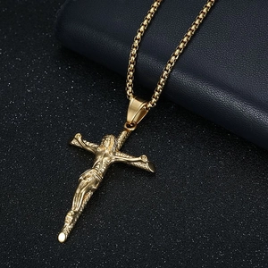 Gold stainless steel crucifix cross pendant necklace with box chain on blue background