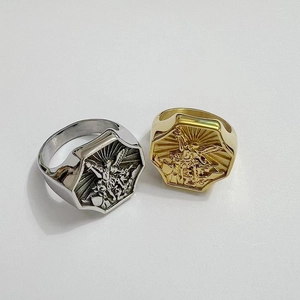 Macro detail of Archangel Saint Michael relief on hexagonal steel signet rings