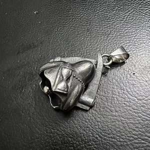 Detail of vintage stainless steel grim reaper guardian bell with hourglass and scythe