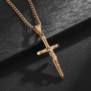 Golden stainless steel crucifix pendant on a polished Cuban chain necklace for men and women