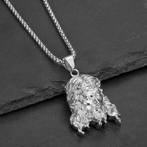 Jesus Christ relief pendant necklace with box chain on dark stone background