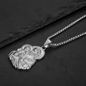Religious Holy Family medallion necklace in silver stainless steel on grey stone background