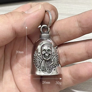 Handheld view showing dimensions of a stainless steel skull and wings guardian bell pendant