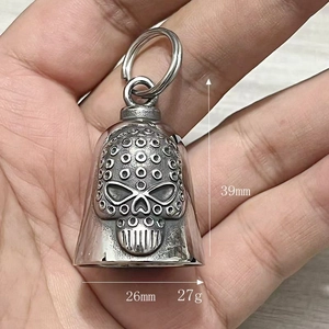 Macro view of stainless steel skull bell pendant with dimensions 39mm by 26mm
