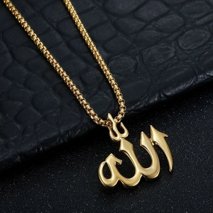 Detailed view of gold Allah Arabic calligraphy pendant on a box chain necklace