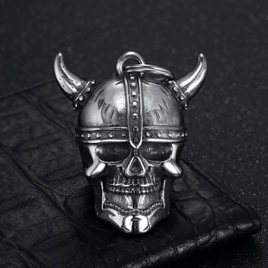 Vintage stainless steel Viking skull helmet biker bell pendant on black leather background