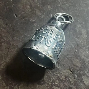 Detailed close-up of retro biker gremlin bell with Screw It Let's Ride engraving