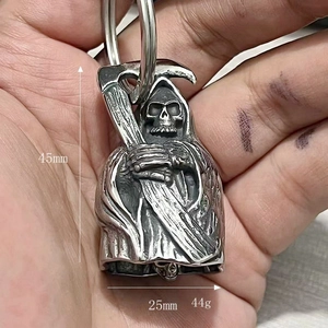 Gothic reaper bell charm held in hand, showing 45mm height and 25mm width dimensions