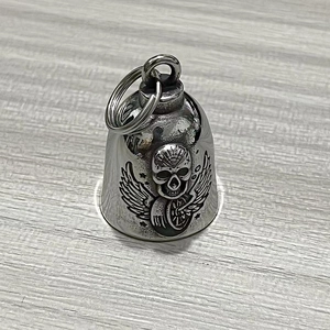 Macro shot of stainless steel winged skull guardian bell with vintage black finish details