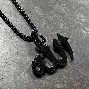 Detailed view of black stainless steel Allah calligraphy pendant with polished mirror finish