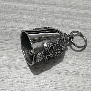 Close-up of stainless steel skull guardian bell with intricate gothic relief patterns